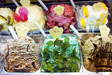 Gelato ice cream shop selling mint, hazlenut, coffee, lemon, strawberry flavours in Siena, Italy