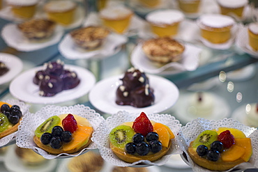 Cakes and pastries in shop window of luxury patticeria, caffe sweet shop Gilli in Florence, Tuscany, Italy