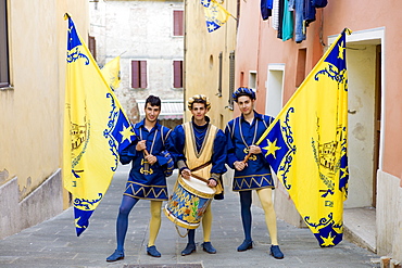 Members of the Corso Contrada in livery costumes for traditional parade in Asciano, inTuscany, Italy