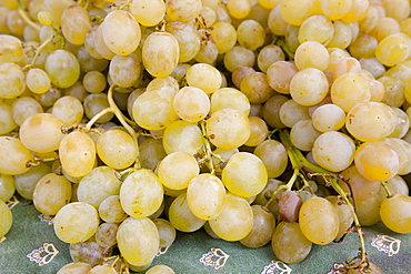 Fresh green grapes on sale at weekly street market in Panzano-in-Chianti, Tuscany, Italy