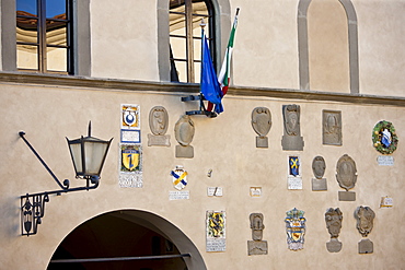 Badge crests on the Town Hall, The Palace of the Podesta, in Piazza Francesco Ferrucci, Radda-in-Chianti, Tuscany, Italy