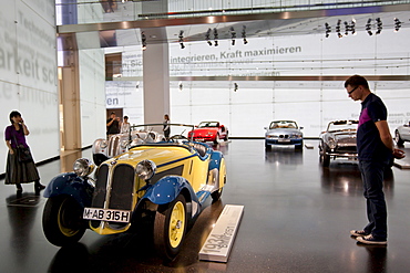 Visitor at BMW Museum views BMW 315 1934 model car on display at the BMW Headquarters in Munich, Bavaria, Germany