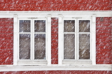 Traditional architecture on snowy day in city of Tromso, in the Arctic Circle in Northern Norway