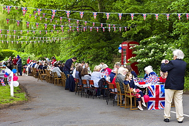 Street party with Union Jack flags and bunting to celebrate Queen's Diamond Jubilee at Swinbrook in The Cotswolds, UK