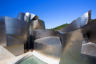 Architect Frank Gehry's Guggenheim Museum futuristic architectural design in titanium and glass at Bilbao, Basque country, Spain