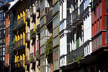 Traditional glasshouses with glass-covered balconies in Bilbao, Spain