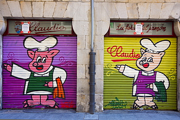 Shop fronts of butchers shop with shutters drawn in Bilbao, Basque country, Spain