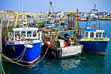 Traditional brightly coloured fishing boats and trawlers in County Wexford, Southern Ireland