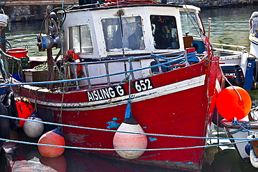 Cobh harbour with brightly coloured fishing boat in County Cork, Ireland