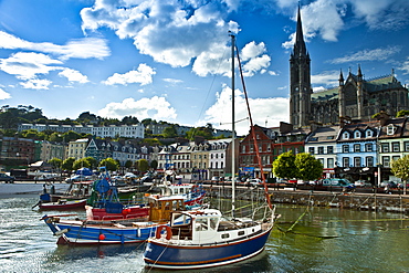 Popular as a tourist destination Cobh harbour with brightly coloured fishing boats in County Cork, Ireland