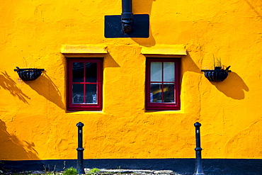 Brightly coloured exterior in terracotta colours of orange and red, Kinsale, County Cork, Ireland