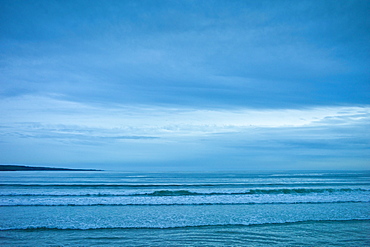 The surf at high tide at the beach resort of Lahinch (Lehinch) at twilight, County Clare, West Coast of Ireland