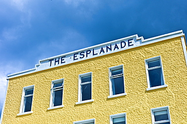 Brightly coloured Esplanade Hotel on the seafront at Kilkee popular beach resort, County Clare, West Coast of Ireland