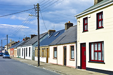 Street scene pastel painted terraced homes in Kilkee, County Clare, West of Ireland