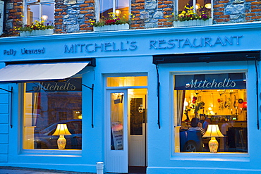 Mitchell's seafood restaurant lit by lamplight, Clifden, Connemara, County Galway, Ireland