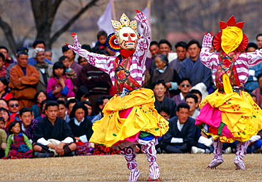 Masked dancers of the Royal Troupe perform Skeleton Dance, Paro, Bhutan