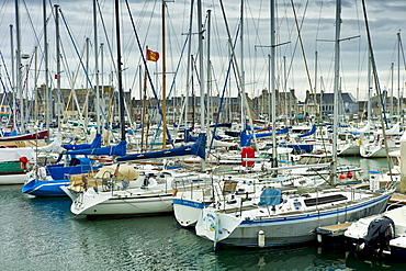 Yachts and power boats moored in the Marina at St Vaast la Hougue channel port in Normandy, France