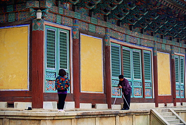 Tourists visiting the Pulguksa Temple in South Korea pause to take photographs of each other