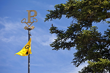 Emblem and flag at the famous Chateau Petrus wine estate at Pomerol in the Bordeaux region of France