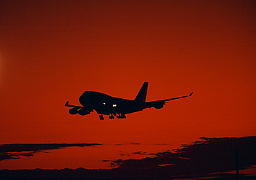 Boeing 747 Jumbo Jet lands at sunset in Australia