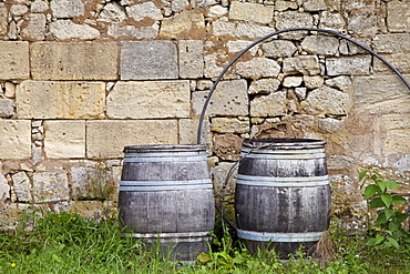 Traditional old wine barrels at a wine chai near St Emilion, Bordeaux, France