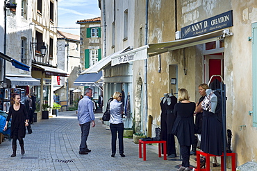 Street scene tourists shopping at St Martin de Re,  Ile de Re, France