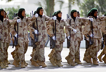 Female armed soldiers parade in camouflage uniform in Abu Dhabi  for celebration of 20th Anniversary of United Arab Emirates