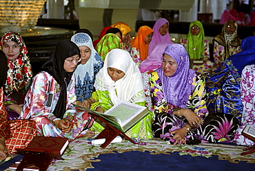 Girls and women studying the Koran at the madrassa at the Jame'asr Hassanal Bolkiah Mosque in Brunei Darussalam