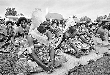 Locals attending traditional native kava ceremony at tribal gathering in Fiji, South Pacific