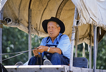 Wagon driver costume character at Fort Edmonton Park living history museum, Alberta, Canada