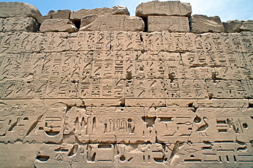 Ancient inscriptions on a wall in the Great Hypostyle Hall, Karnak Temple, Luxor, Egypt