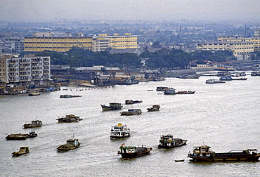 Houseboats and cargo boats on the Pearl River at Canton, China in the 1980s