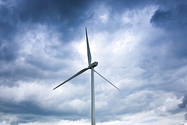 Wind turbines for wind power in meadow in rural Normandy, France