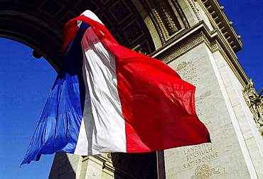 French Tricolore flag at the Arc de Triomphe for Remembrance Day in Paris, France