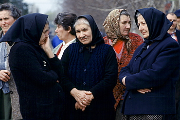 Croatian women escape the fighting in Yugoslavia as refugees in Hungary, wearing traditional widow's black clothing