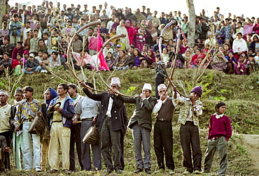 Locals playing traditional Narsiha wind instruments for cultural celebration in the foothills of the Himalayas at Pokhara in Nepal