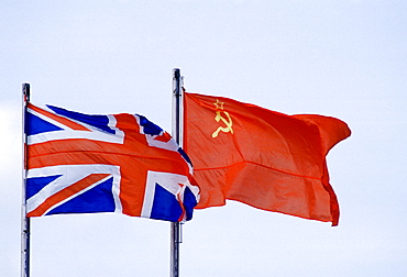 Hammer and Sickle flag alongside British Union Jack flag flying in Moscow, Russia