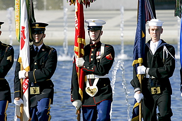 US servicemen, army, airforce, marines and navy provide security at The National World War II Memorial, Washington DC, USA