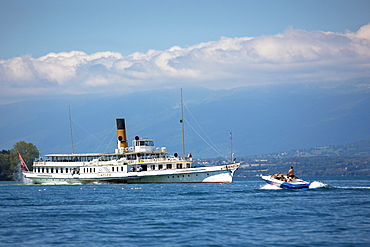 Old paddle steamer ferry crosses Lac Leman (Lake Geneva), from Evian-les-Bains, Rhone-Alpes, France, Europe