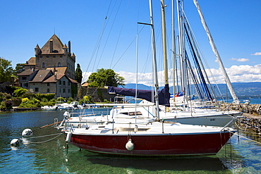 Yachts by the 12th century medieval castle in the old port of Yvoire on Lac Leman (Lake Geneva), Rhone-Alpes, France, Europe