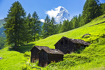 Chalet barns below the Matterhorn mountain in the Swiss Alps near Zermatt, Valais, Switzerland, Europe