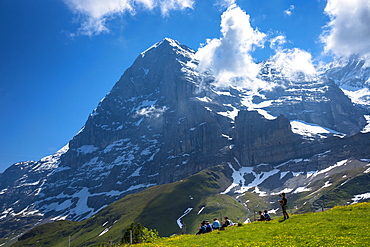 Tourists viewing the North Face of the Eiger from Kleine Scheidegg in the Swiss Alps in Bernese Oberland, Switzerland, Europe