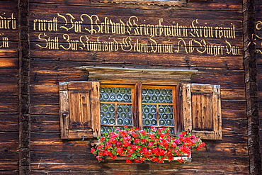 Traditional inscription on 18th century Swiss house built 1741 in Serneus near Klosters, Graubunden region, Switzerland, Europe