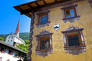 Gasthof Stern hotel and church in Kirchweg in the old part of the town of Oetz in the Tyrol, Austria, Europe