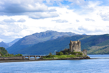 Eilean Donan Castle, a Highland fortress, with Saltire Scottish flag flying in Loch Alsh at Dornie, Kyle of Lochalsh in the western hIghlands of Scotland, United Kingdom, Europe