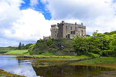 Ancient Highland fortress Dunvegan Castle, the Highlands ancestral home of the MacLeod clan, by Dunvegan Loch, a sea loch on the Isle of Skye, Scotland, United Kingodm, Europe