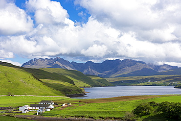 Clouds over the Cuillin mountain range with croft farm and Loch Harport near Coillure, Isle of Skye, Highlands and Islands, Scotland, United Kingdom, Europe