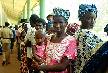 Women queuing with their children at the rural hospital at Basse in Gambia