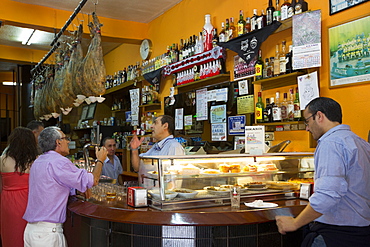 Locals in traditional Spanish tapas raciones Bar Restaurante Bikandi in central Bilbao, Euskadi, Spain, Europe