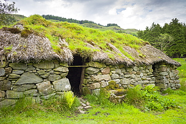 Thatched cottage old stone home at Auchindrain Highland farming township settlement and village folklore museum at Furnace near Inveraray in the Highlands, Scotland, United Kingdom, Europe